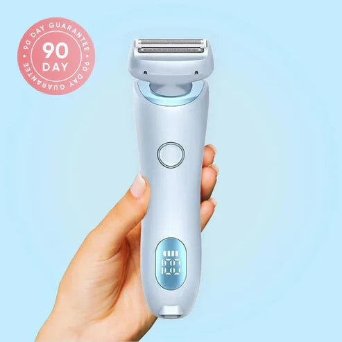 SilkGlide Pro cordless 2-in-1 electric shaver for women with LED display being held against a light blue background.