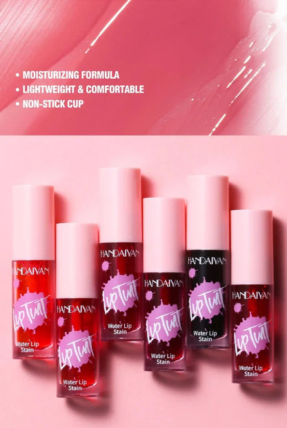 Moisturizing Fruit Juice lip tint and cheek stain bottles in various red and pink shades with smooth texture swatches.