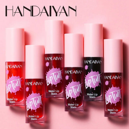Six shades of HANDAIYAN Fruit Juice water lip and cheek stains in clear tubes with pink caps against a pink background.