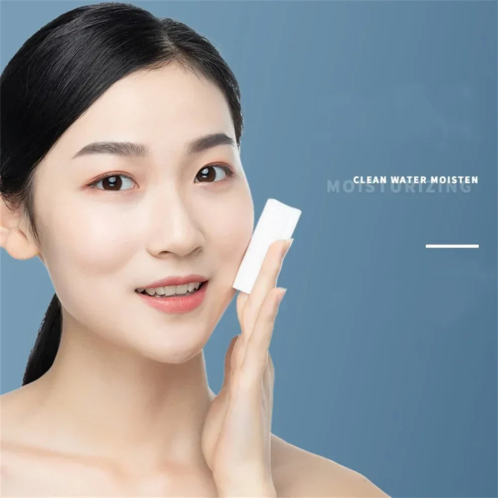 Woman using Bioaqua Micellar Water on a cotton pad to cleanse her face, illustrating gentle makeup removal.