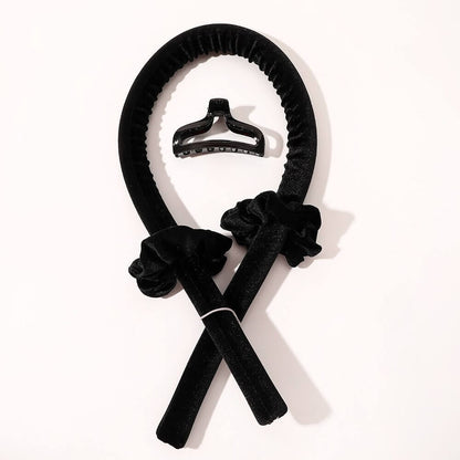 Black velvet heatless hair curler set with matching scrunchies and large claw clip for overnight heatless curls.