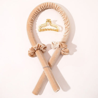 CurlBliss champagne velvet heatless hair curler set with matching scrunchies and a clear yellow claw clip.