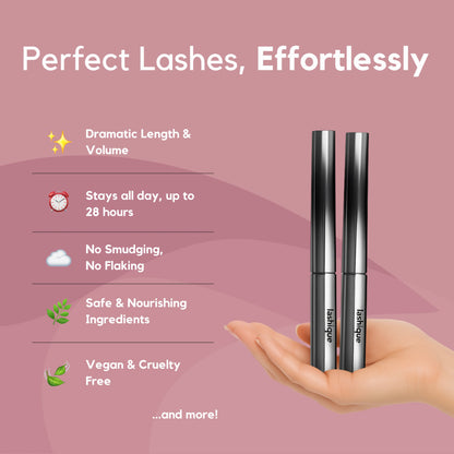 Two Lashique Metal Wand Mascaras in a hand, highlighting benefits like smudge-proof, volumizing, and 28-hour wear.