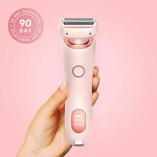 Pink SilkGlide Pro 2-in-1 electric shaver and trimmer for women held in hand against a soft pink background.