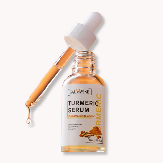 Brightening Turmeric Essential Oil Serum in a clear glass bottle with a dropper for dark spot and acne mark treatment.